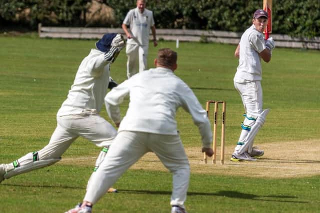 Cloughton wicketkeeper Jimmy Beadle takes a catch during his side's win at Fylingdales. Picture by Brian Murfield.