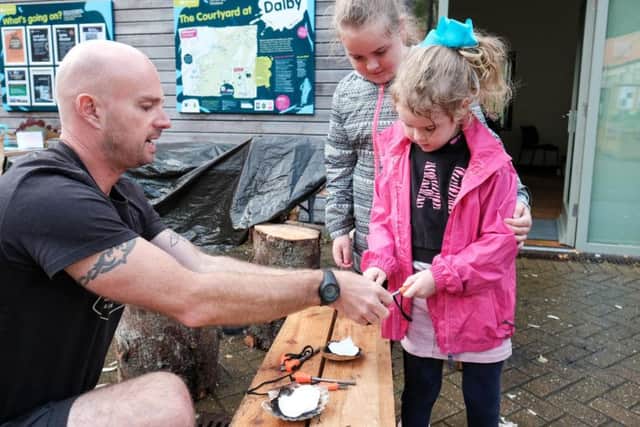 Mya and Kasey try out bushcraft skills with Matt Jones of Hidden Horizons.