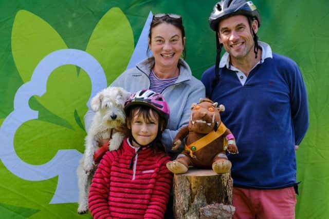Gill and Kev with 8 year old Olivia and Poppy the dog get a picture taken with the Gruffalo
