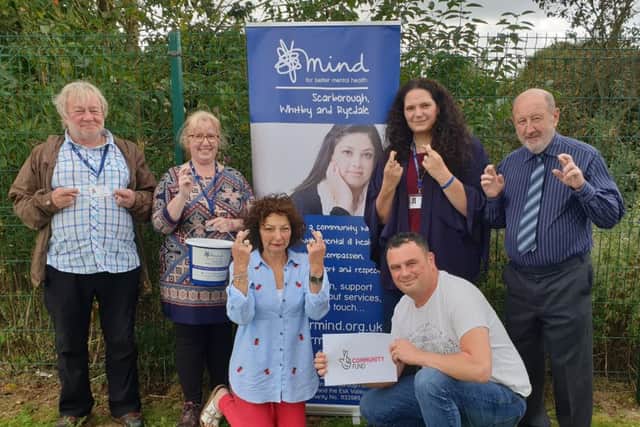 Members of the SWR Mind team celebrate the National Lottery windfall.