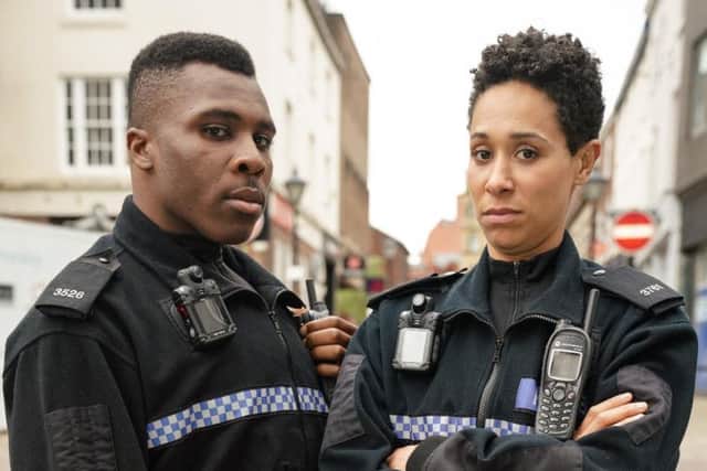 PC Merrick (Olisa Odele)and PC Treeves (Rebecca Scroggs). PIC: BBC/Kieron McCarron