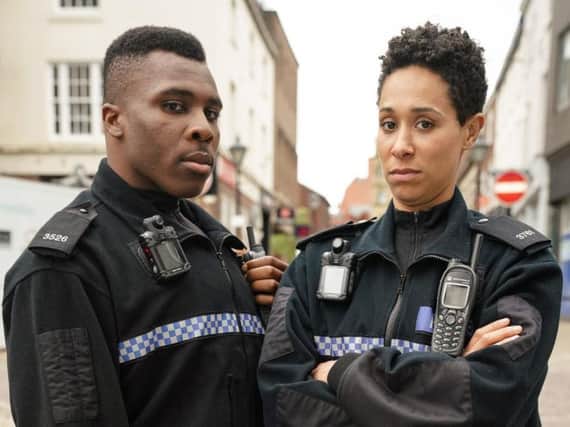 PC Merrick (Olisa Odele)and PC Treeves (Rebecca Scroggs). PIC: BBC/Kieron McCarron