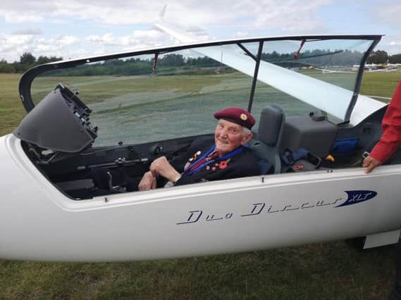 Ray Whitwell, 100, takes to the skies in a glider flight during a visit to Holland.
