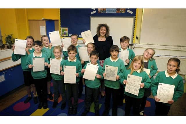 Danby School Children show off the letters they wrote.