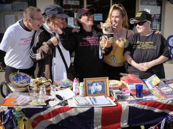 Sandra Wilson, centre, with volunteers at her mental health stall in Scarborough. PIC: Richard Ponter