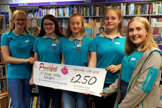 Some of the 1st Forge Valley Rangers with the cheque from Proudfoot.