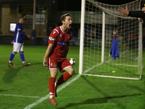 Chris Dawson celebrates his late winner at Matlock Town on Tuesday night. Picture by Richard Parkes.