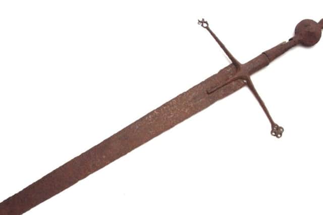 Highlander sword sold at auction at Hutchinson Scott, at Skipton, for 30,000. The sword is believed to date from the 15th or 16th Century and was originally valued at 200. Picture: SWNS