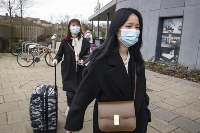 Two women pictured wearing face masks in York last week where two people were taken ill. A third case of the coronavirus has now been confirmed in the UK. Picture: Danny Lawson/PA