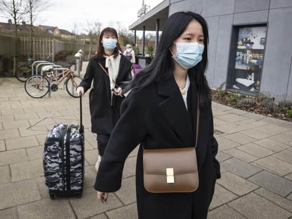 Two women pictured wearing face masks in York last week where two people were taken ill. A third case of the coronavirus has now been confirmed in the UK. Picture: Danny Lawson/PA