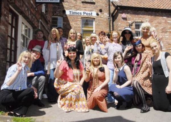 Advertising staff at the Driffield Times & Post Offices for the Summer of Love themed sales day. Pictured by Pam Stanforth (ps1323-22a)