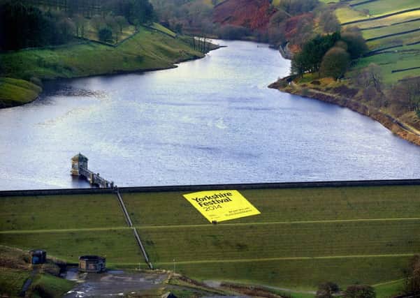 The Yorkshire Festival 2014 has been launched by unveiling of a hugh banner down the the side of Lower Laithe Reservoir near Haworth.