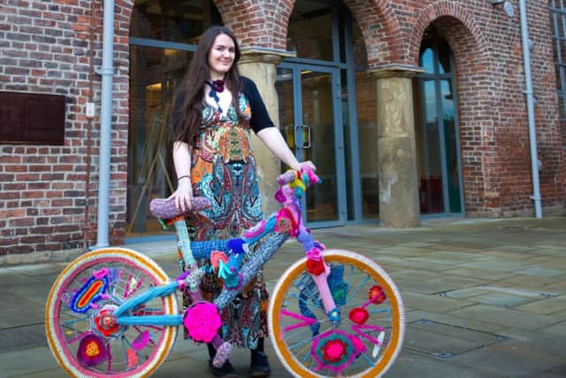 Yarn storm artist Cassandra Kilbride pictured with an example of a wool-covered bicycle similar to those that will be exhibited as part of her Woolly Bike Trail project. +picture: Jess Rowbottom/ jrphotos.net