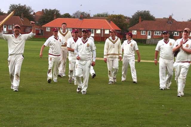Staxton celebrate their win at Filey to seal the premier division title
