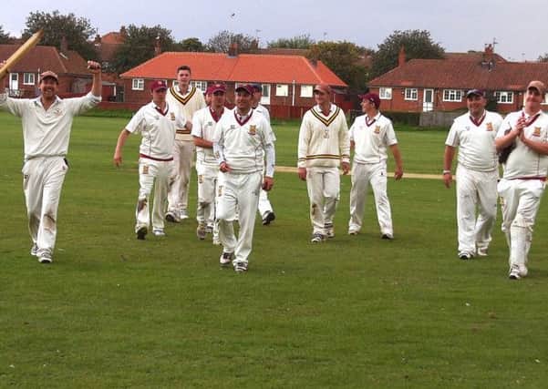 Staxton celebrate their win at Filey to seal the premier division title