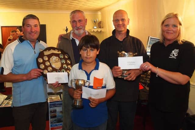 from left, Filey Brigg Angling Society Chairman Adrian Colling,Richard Haxby (Sweep Winner with a cod 6-13-0) Junior Winner Matty Burton (Scar, cod 2-11-09) Mark Smith (Redcar winner of the Late Harry Jarman Bowl and £200 with a catch mixed fish weighing19pound) Sharon Brannan of Filey Sports association competition sponsors.