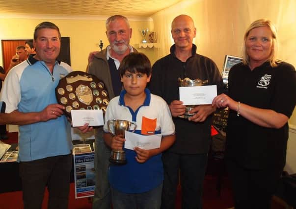 from left, Filey Brigg Angling Society Chairman Adrian Colling,Richard Haxby (Sweep Winner with a cod 6-13-0) Junior Winner Matty Burton (Scar, cod 2-11-09) Mark Smith (Redcar winner of the Late Harry Jarman Bowl and £200 with a catch mixed fish weighing19pound) Sharon Brannan of Filey Sports association competition sponsors.