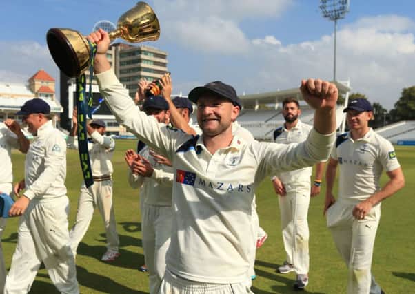 Yorkshire's Adam Lyth celebrates winning the Division One County Championship trophy during day four of the LV= County Championship Division One match at Trent Bridge, Nottingham. SSOCIATION Photo. Picture date: Friday September 12, 2014. See PA story CRICKET Nottinghamshire. Photo credit should read: Mike Egerton/PA Wire