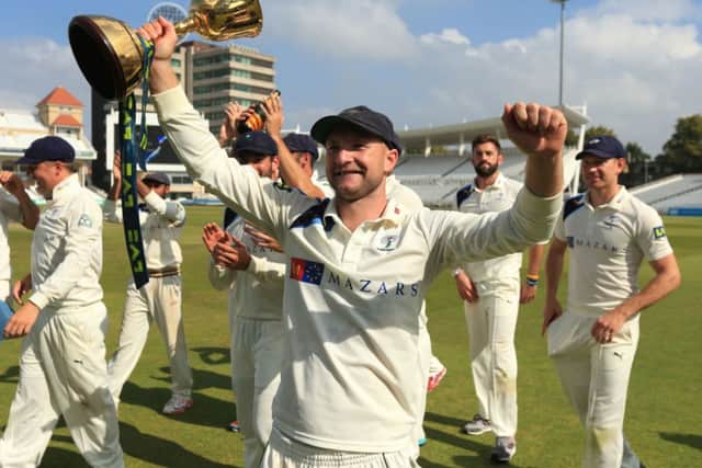 Yorkshire's Adam Lyth celebrates winning the Division One County Championship trophy during day four of the LV= County Championship Division One match at Trent Bridge, Nottingham. SSOCIATION Photo. Picture date: Friday September 12, 2014. See PA story CRICKET Nottinghamshire. Photo credit should read: Mike Egerton/PA Wire