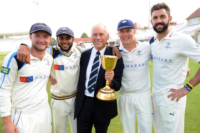 LV = County Championship Division One.
Nottinghamshire v Yorkshire.
Yorkshire's players celebrate after winning the championship. From left, Adam Lyth, Adil Rashid, Executive Chairman Colin Graves, Gary Ballance and Liam Plunkett.
12th September 2014. Picture Jonathan Gawthorpe.