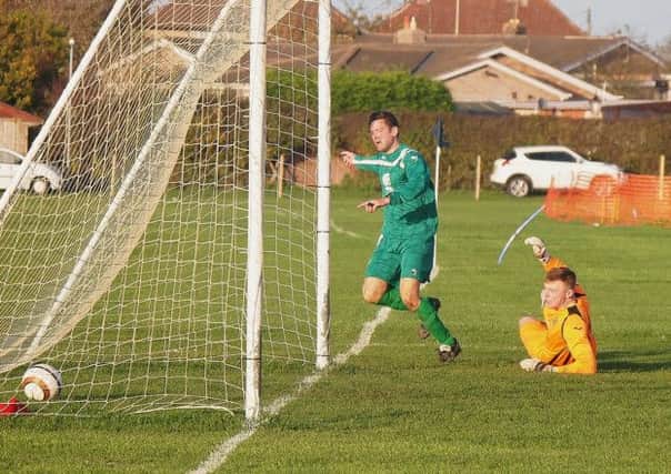 Steve Roberts nets for Cayton in their 7-3 defeat at home to Cargo Fleet