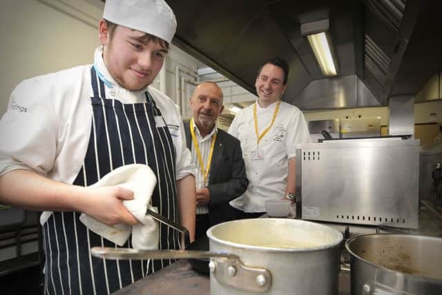 Yorkshire Coast College cooking competition with  Jamie Webster working  hard ,with President of Rotary Scarborough Cavaliers Mike Wilkinson,and James Mackenzie.. pic Richard Ponter 144826a