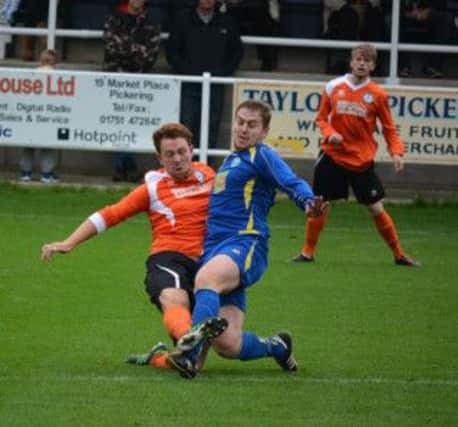 Billy Logan in action for Pickering Town