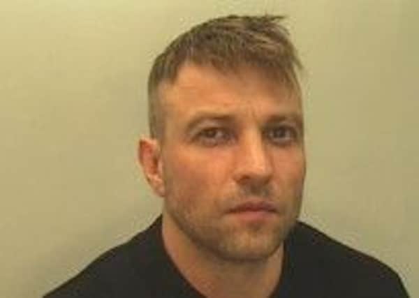 Wanted Russell Frankland, who is said to have attacked security guards before fleeing custody.