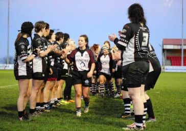 Scarborough Valkyries captain Cathy-Ann Myers, who bagged a hat-trick of tries in their 56-0 win, leads her team through the Workington guard of honour                   	      Picture: Andy Standing