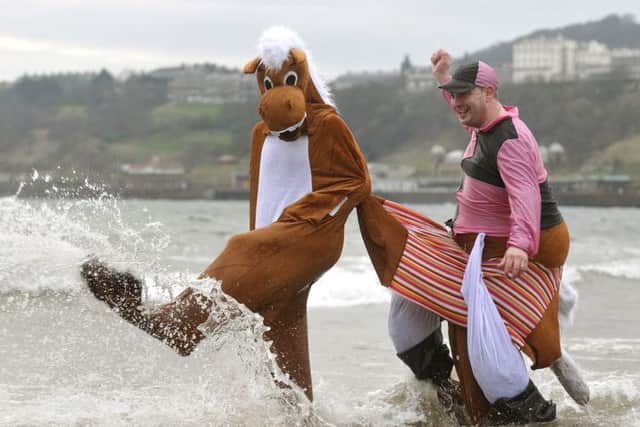 Scarborough New Years Day dip 2015. Racing into the sea ahead of the pack . pic Richard Ponter 150102a