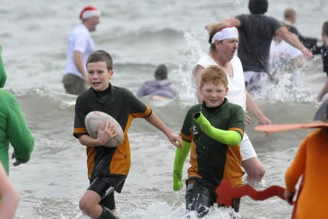 Scarborough New Years Day dip 2015.Rugby action at sea.. pic Richard Ponter 150102d