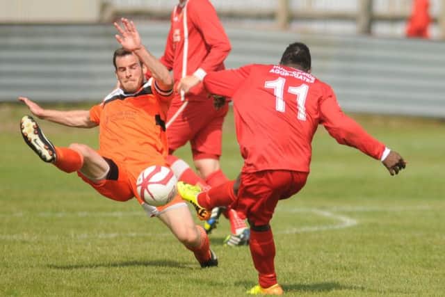 Bridlington Town's Duka has his shot blocked by Scarborough Athletic's Chris Bolder
