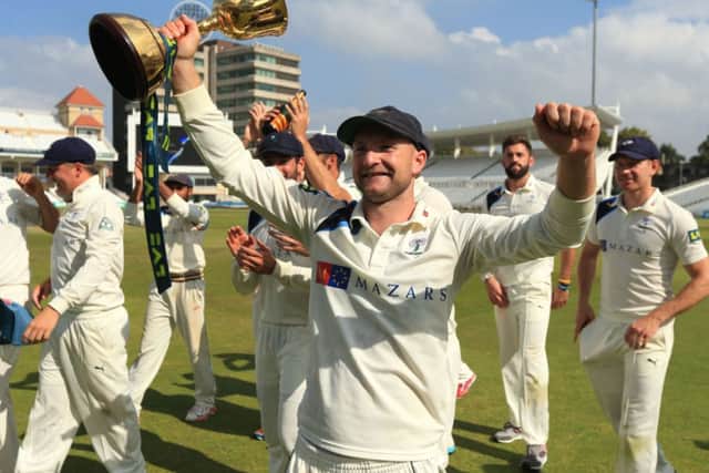Yorkshire's Adam Lyth celebrates winning the Division One County Championship trophy during day four of the LV= County Championship Division One match at Trent Bridge, Nottingham. SSOCIATION Photo. Picture date: Friday September 12, 2014. See PA story CRICKET Nottinghamshire. Photo credit should read: Mike Egerton/PA Wire