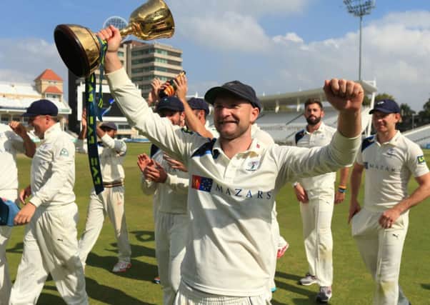 Yorkshire's Adam Lyth celebrates winning the Division One County Championship trophy during day four of the LV= County Championship Division One match at Trent Bridge, Nottingham. SSOCIATION Photo. Picture date: Friday September 12, 2014. See PA story CRICKET Nottinghamshire. Photo credit should read: Mike Egerton/PA Wire