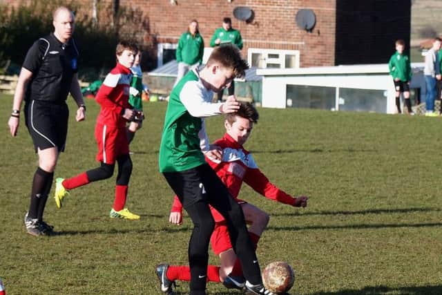Kirkby slide in a tackle to halt the hosts progress