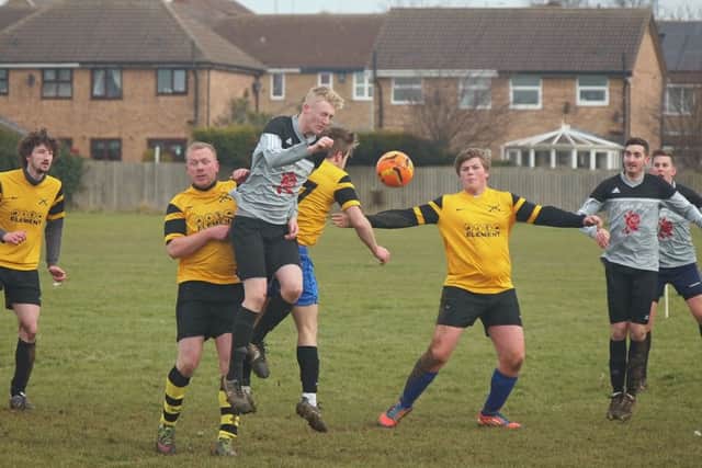 Traf Reserves lose out to Alma in a crowded midfield header.