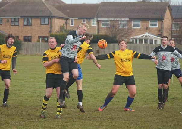 Traf Reserves lose out to Alma in a crowded midfield header.