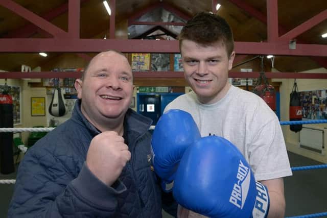 Former featherweight world champ Paul Ingle passes on his knowledge to George Rhodes Jnr, who has turned professional. Pictures: Paul Atkinson