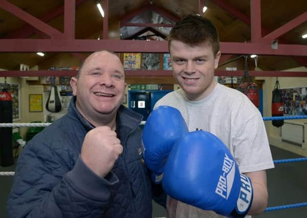 Former featherweight world champ Paul Ingle passes on his knowledge to George Rhodes Jnr, who has turned professional. Pictures: Paul Atkinson