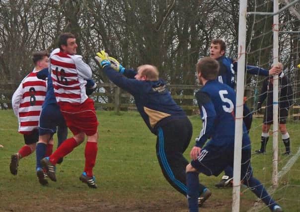 Falsgrave keeper Ryan Goodworth safely collects a Tennyson attempt.