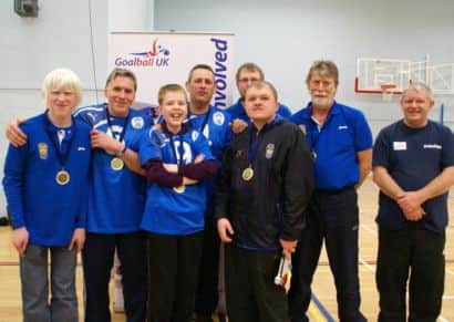 Scarborough Goalball Clubs triumphant novice team, back, from left, Charlie Woodhead, Jerry Woodhead, Brian Vasey, Dan Hudson, Dave Potter (coach), Robert Avery (referee), front, Stuart Hudson and Curtis Vasey