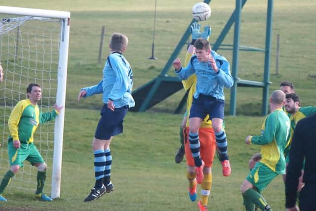 Duchess keeper Pavel Nowaczyki punches clear a Cayton header during the latter's 4-2 cup semi-final success