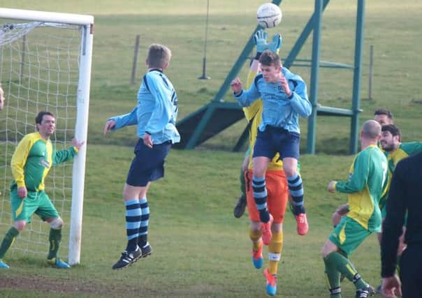 Duchess keeper Pavel Nowaczyki punches clear a Cayton header during the latter's 4-2 cup semi-final success