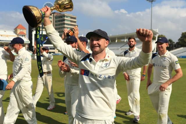Yorkshire's Adam Lyth celebrates winning the Division One County Championship trophy during day four of the LV= County Championship Division One match at Trent Bridge, Nottingham. SSOCIATION Photo. Picture date: Friday September 12, 2014. See PA story CRICKET Nottinghamshire. Photo credit should read: Mike Egerton/PA Wire