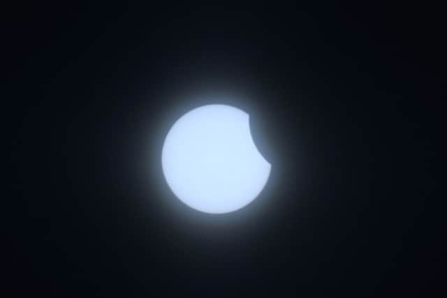 An eclipse of the sun begins