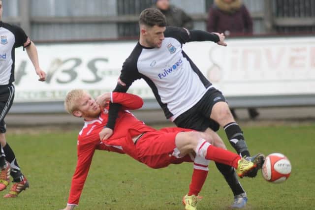 Boro's Dean Lisles gets stuck into Bamber Bridge's Darren Green