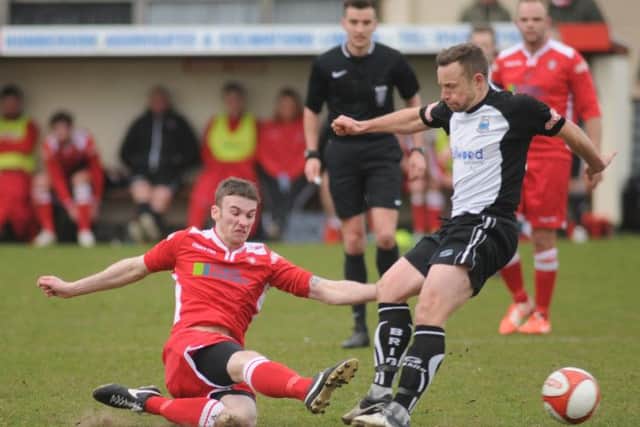 Boro's Kieran McCaffrey gets stuck into Bamber's Paul McKenna