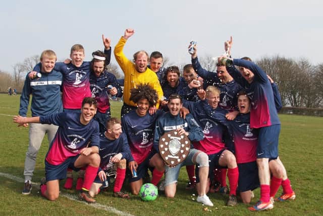 Traf Res celebrate clinching their third consecutive league two championship.
