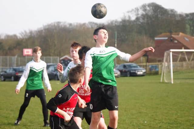 Jackdaws look on as Flixton win the header