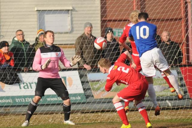 Salford's Gareth Seddon rises to head the third goal Picture by Dom Taylor